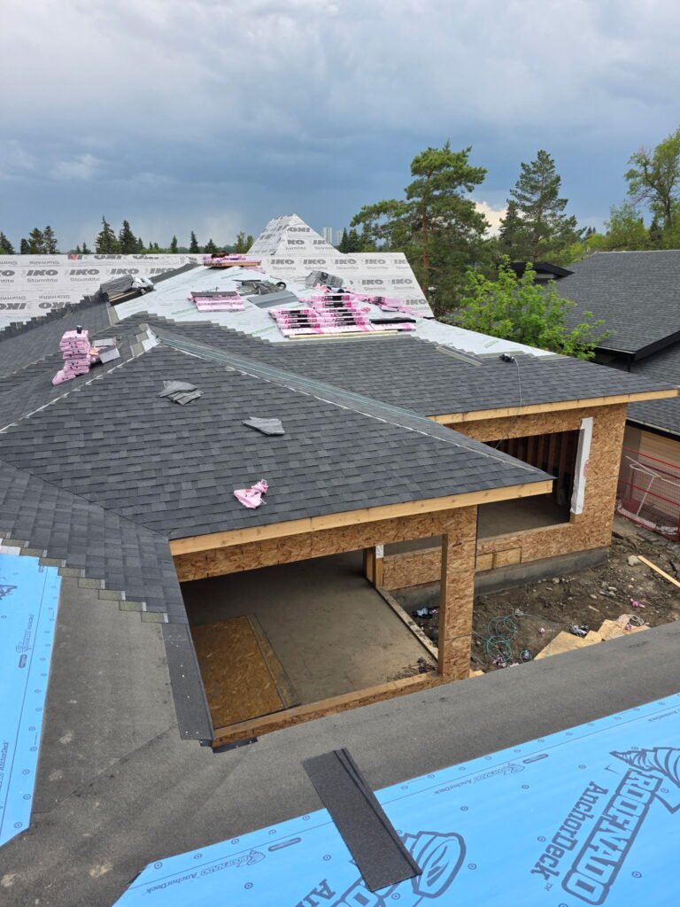 Asphalt shingle roof replacement in progress on a Calgary house