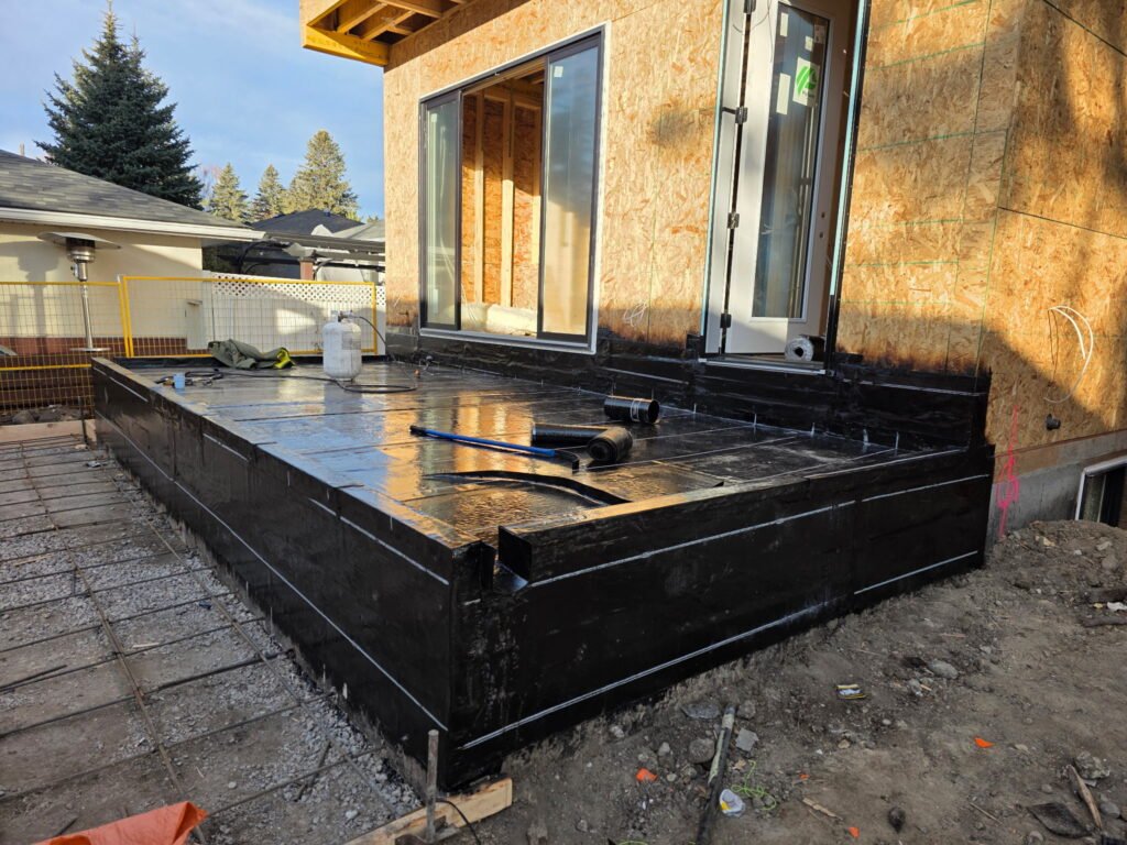 Completed black membrane roof on a modern Calgary home